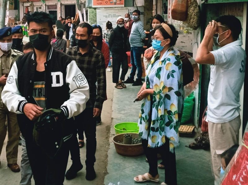 People walk in the streets of Kohima wearing face masks. (Morung File Photo)